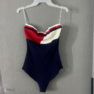 Navy blue, red, and white body suit never worn before